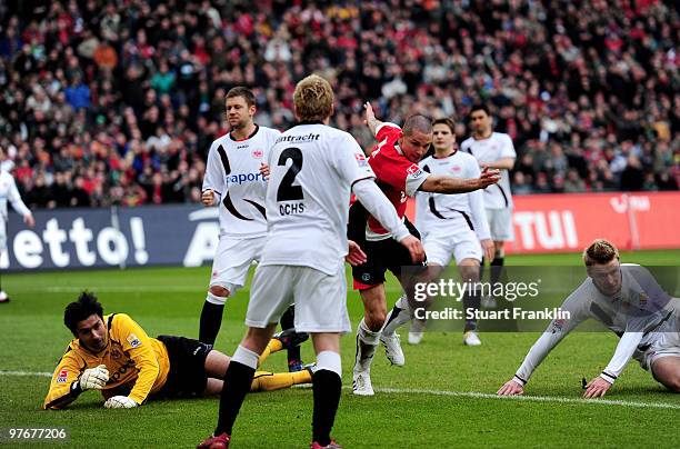 Leon Andreasen of Hannover scores his teams first goal during the Bundesliga match between Hannover 96 and Eintracht Frankfurt at AWD-Arena on March...