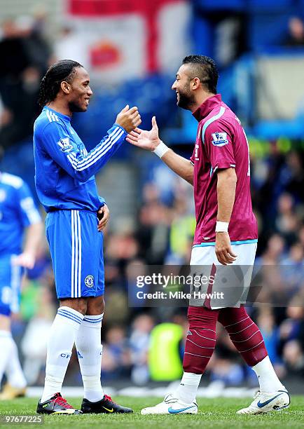 Opposing strikers Didier Drogba of Chelsea and Mido of West Ham greet each other prior to kickoff during the Barclays Premier League match between...