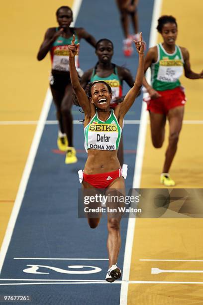 Meseret Defar of Ethiopia celebrates winning the gold medal in the Womens 3000m during Day 2 of the IAAF World Indoor Championships at the Aspire...