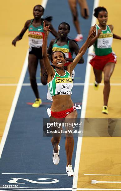 Meseret Defar of Ethiopia celebrates winning the gold medal in the Womens 3000m during Day 2 of the IAAF World Indoor Championships at the Aspire...