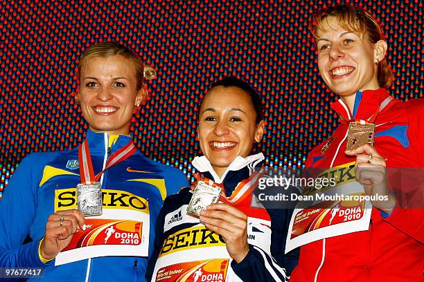 Natallia Dobrynska of Ukraine celebrates the silver medal, Jessica Ennis of Great Britain the gold medal and Tatyana Chernova of Russia the bronze...