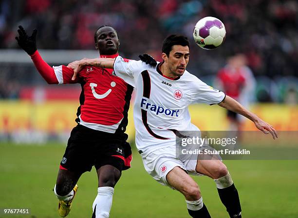 Didier Ya Konan of Hannover is challenged by Chris of Frankfurt during the Bundesliga match between Hannover 96 and Eintracht Frankfurt at AWD-Arena...