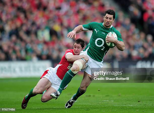 Rob Kearney of Ireland is tackled by Shane Williams of Wales during the RBS Six Nations match between Ireland and Wales at Croke Park Stadium on...