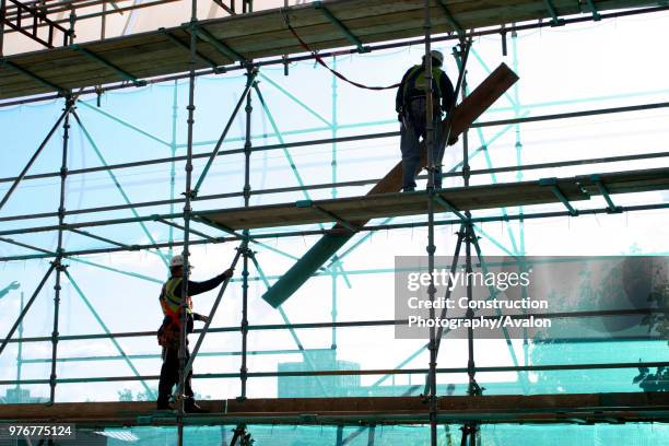 Scaffolder erecting a scaffolding.