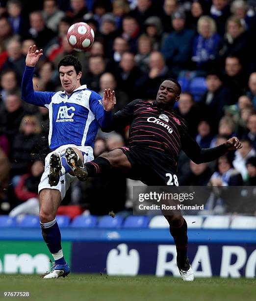 Victor Anichebe of Everton is challenged by Liam Ridgwell of Birmingham during the Barclays Premier League match between Birmingham City and Everton...