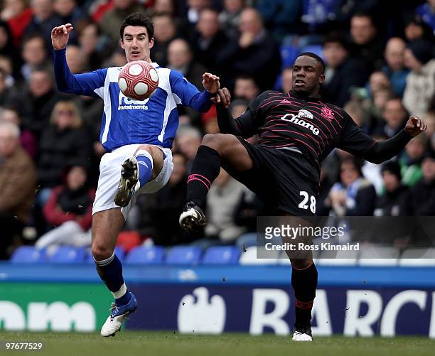 Victor Anichebe of Everton is challenged by Liam Ridgwell of Birmingham during the Barclays Premier League match between Birmingham City and Everton...