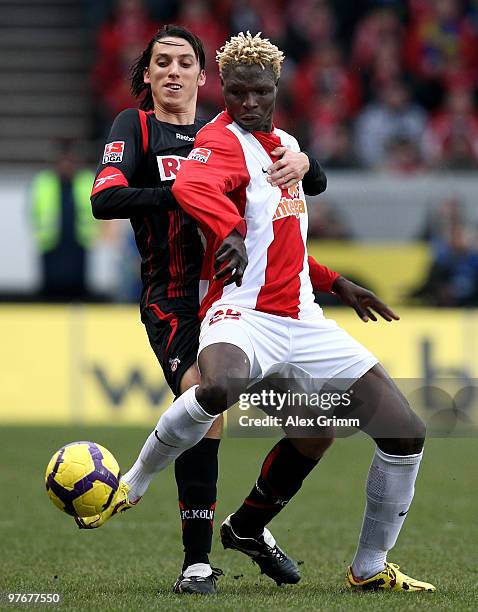 Aristide Bance of Mainz is challenged by Pedro Geromel of Koeln before being sent off during the Bundesliga match between FSV Mainz 05 and 1. FC...