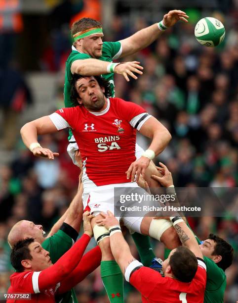 Jamie Heaslip of Ireland beats Jonathan Thomas of Wales to a lineout ball during the RBS Six Nations match between Ireland and Wales at Croke Park...