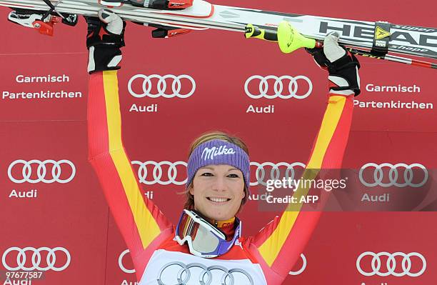 Overall winner Germany's Maria Riesch poses in the finish area after the women's Alpine skiing World Cup Slalom finals in Garmisch Partenkirchen,...