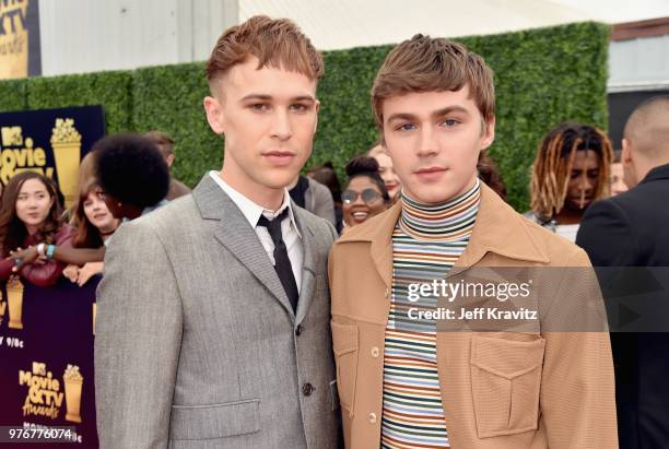 Actors Tommy Dorfman and Miles Heizer attend the 2018 MTV Movie And TV Awards at Barker Hangar on June 16, 2018 in Santa Monica, California.