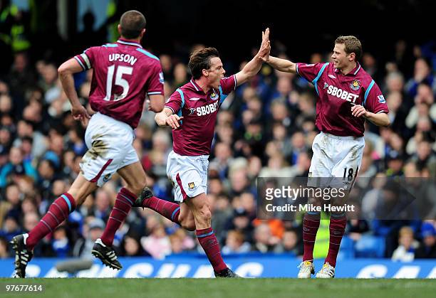 Scott Parker of West Ham celebrates with teammate Jonathan Spector after levelling the scores at 1-1 during the Barclays Premier League match between...