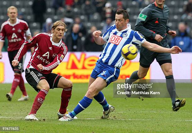 Pal Dardai of Berlin battles for the ball with Marcel Risse of Nuernberg during the Bundesliga match between Hertha BSC Berlin and 1.FC Nuernberg at...