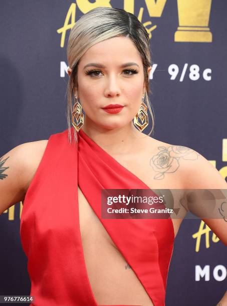 Halsey arrives at the 2018 MTV Movie And TV Awards at Barker Hangar on June 16, 2018 in Santa Monica, California.