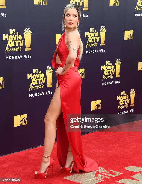 Halsey arrives at the 2018 MTV Movie And TV Awards at Barker Hangar on June 16, 2018 in Santa Monica, California.