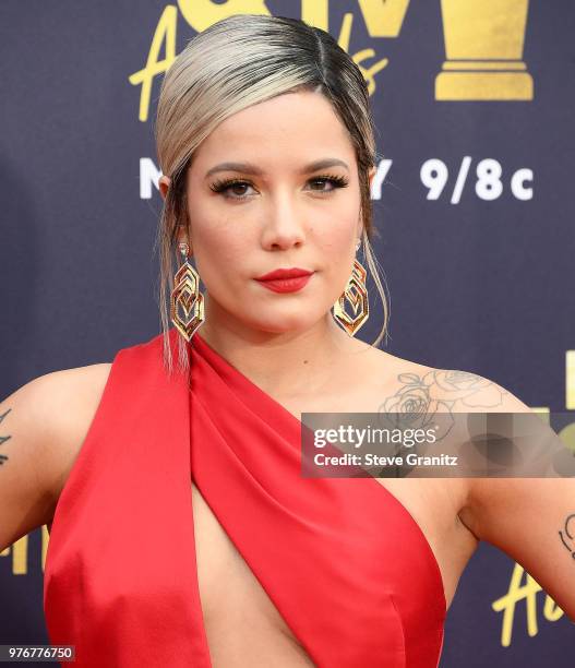 Halsey arrives at the 2018 MTV Movie And TV Awards at Barker Hangar on June 16, 2018 in Santa Monica, California.