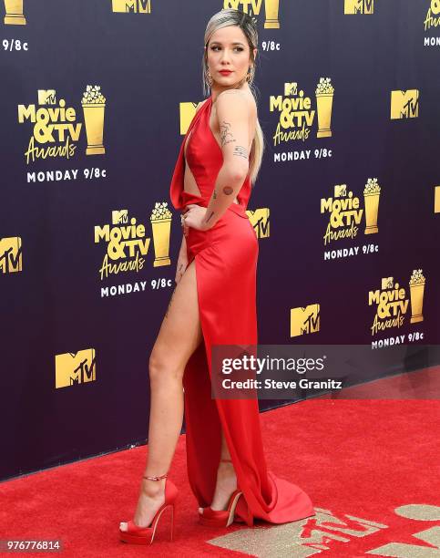 Halsey arrives at the 2018 MTV Movie And TV Awards at Barker Hangar on June 16, 2018 in Santa Monica, California.