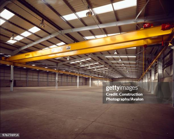 Interior of empty steel-framed warehouse.