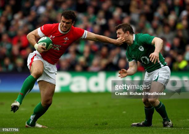 Jamie Roberts of Wales hands off Brian O'Driscoll of Ireland during the RBS Six Nations match between Ireland and Wales at Croke Park Stadium on...