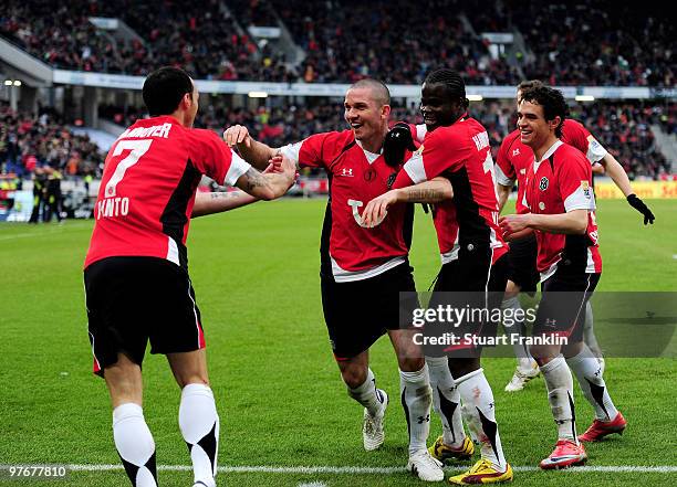 Sergio Pinto of Hannover celebrates scoring his team's second goal with team mate Leon Andreasen during the Bundesliga match between Hannover 96 and...