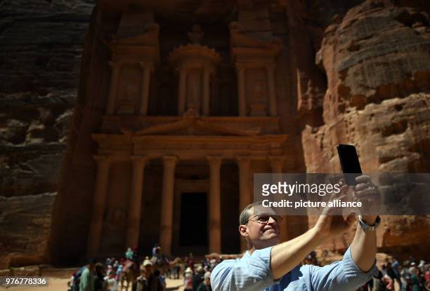 Dpatop - German Berlin Governing Mayor and president of the Bundesrat, Michael Mueller takes a selfie during his visit to archaeological city of...