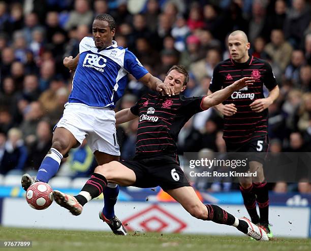 Phil Jagielka of Everton is challenges by Cameron Jerome of Birmingham during the Barclays Premier League match between Birmingham City and Everton...