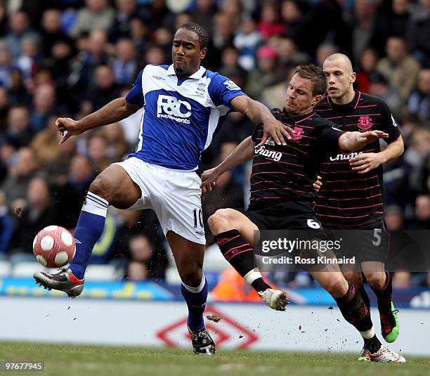 Phil Jagielka of Everton is challenges by Cameron Jerome of Birmingham during the Barclays Premier League match between Birmingham City and Everton...