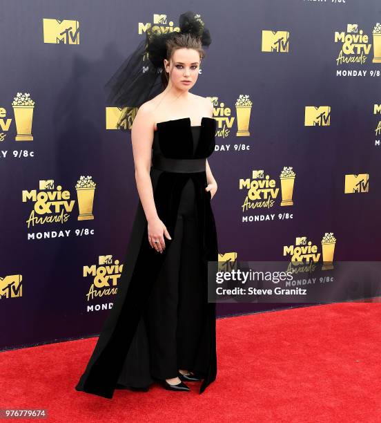 Katherine Langford arrives at the 2018 MTV Movie And TV Awards at Barker Hangar on June 16, 2018 in Santa Monica, California.