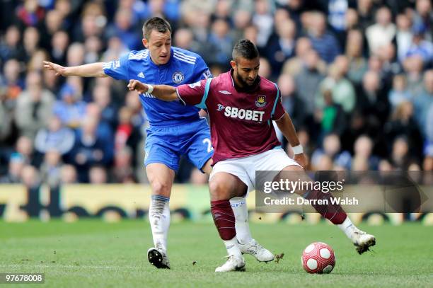 Mido of West Ham is challenged by John Terry of Chelsea during the Barclays Premier League match between Chelsea and West Ham United at Stamford...