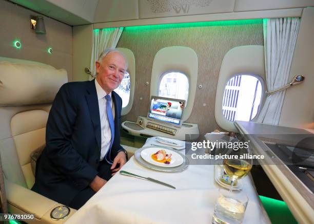 April 2018, Germany, Hamburg: Tim Clark, president of Emirates Airline, sits in the first class Suite inside an Emirates' Boeing 777 during a press...