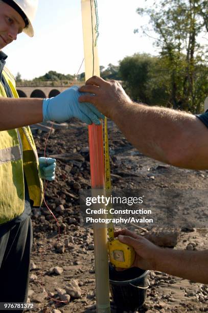 Remediation Engineers checking samples.