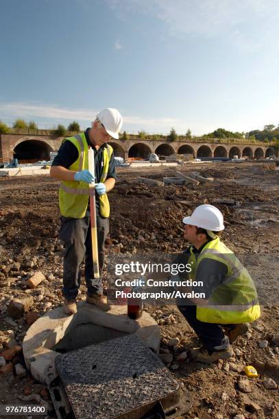 Remediation Engineers taking samples.