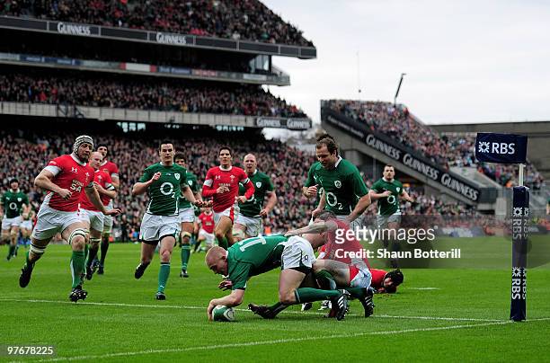 Keith Earls of Ireland scores a try during the RBS Six Nations match between Ireland and Wales at Croke Park Stadium on March 13, 2010 in Dublin,...
