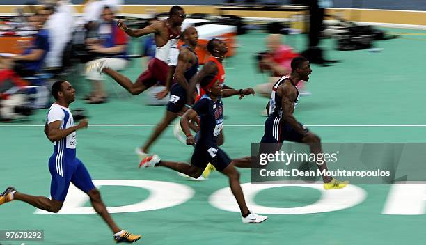 Dwain Chambers of Great Britain celebrates winning Gold in the Mens 60m Final during Day 2 of the IAAF World Indoor Championships at the Aspire Dome...