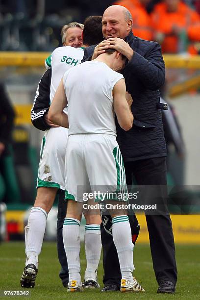 Manager Dieter Hoeness of Wolfsburg celebrates the 4:0 victory with Jan Simunek of Wolfsburg after the Bundesliga match between Borussia...