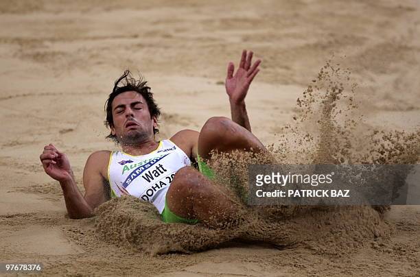 Australia's Mitchell Watt lands in the sand during the men's long jump final at the 2010 IAAF World Indoor Athletics Championships at the Aspire Dome...