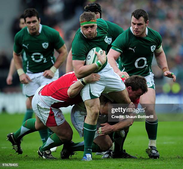 Jamie Heaslip of Ireland breaks through the Wales defence during the RBS Six Nations match between Ireland and Wales at Croke Park Stadium on March...