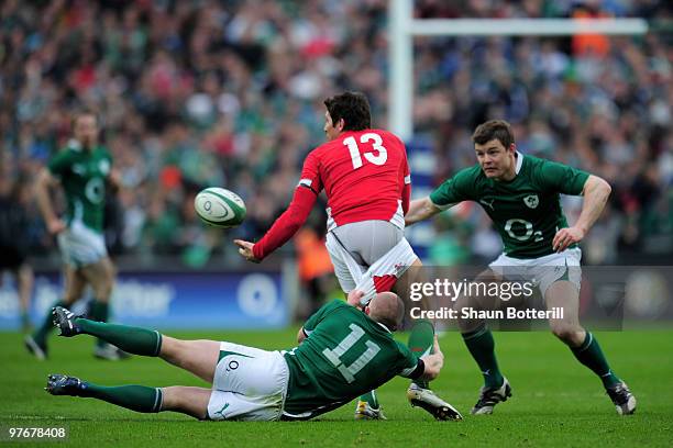 James Hook of Wales is tackled by Keith Earls of Ireland during the RBS Six Nations match between Ireland and Wales at Croke Park Stadium on March...