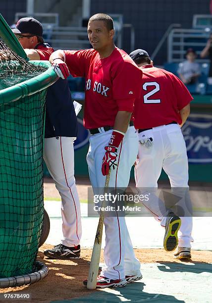 Catcher Victor Martinez of the Boston Red Sox takes batting practice just prior to the start of the Grapefruit League Spring Training Game against...