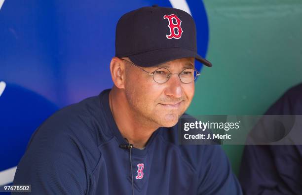 Manager Terry Francona of the Boston Red Sox talks with a reporter just prior to the start of the Grapefruit League Spring Training Game against the...