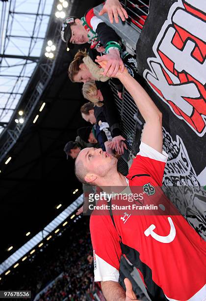 Leon Andreasen of Hannover celebrates with fans at the end of the Bundesliga match between Hannover 96 and Eintracht Frankfurt at AWD-Arena on March...