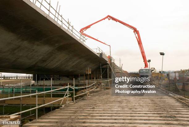 Concrete being pumped into the abutment and wing walls.