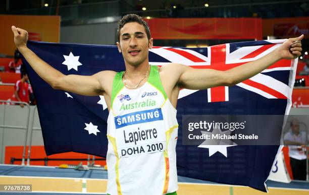 Fabrice Lapierre of Australia celebrates gold in the Mens Long Jump Final during Day 2 of the IAAF World Indoor Championships at the Aspire Dome on...