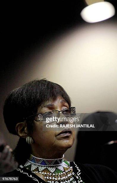Winnie Madikizela Mandela, the former wife of South African former President Nelson Mandela looks on during the funeral of anti apartheid stalwart...