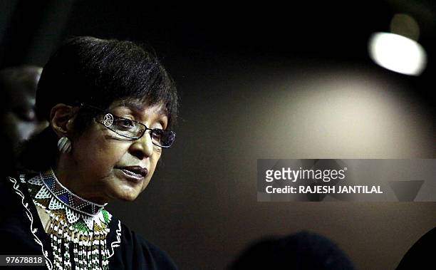 Winnie Madikizela Mandela, the former wife of South African former President Nelson Mandela looks on during the funeral of anti apartheid stalwart...