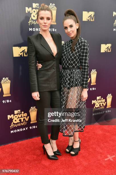 Actors Betty Gilpin and Alison Brie attends the 2018 MTV Movie And TV Awards at Barker Hangar on June 16, 2018 in Santa Monica, California.