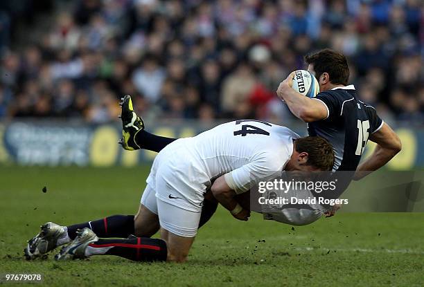 Mark Cueto of England tackles Hugo Southwell of Scotland during the RBS Six Nations Championship match between Scotland and England at Murrayfield...