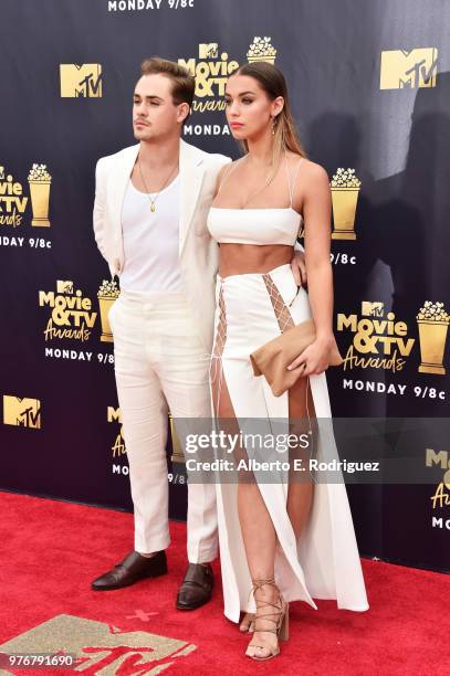 Actor Dacre Montgomery and model Liv Pollock attend the 2018 MTV Movie And TV Awards at Barker Hangar on June 16, 2018 in Santa Monica, California.