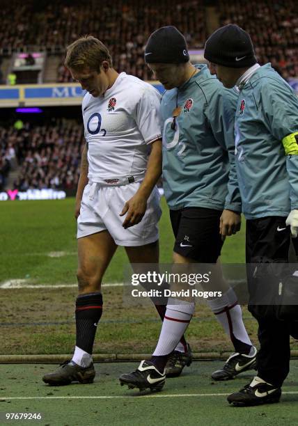 Jonny Wilkinson of England is helped from the pitch with an injury during the RBS Six Nations Championship match between Scotland and England at...