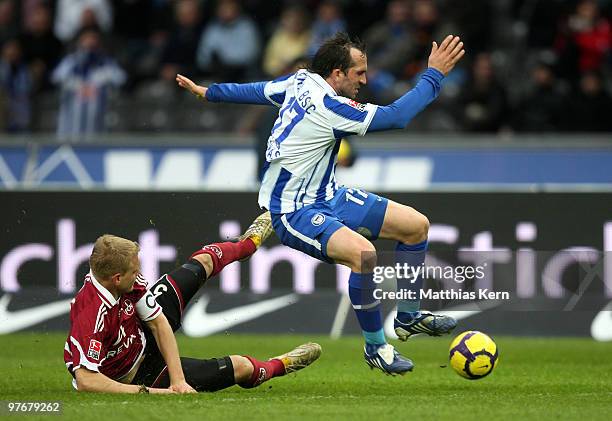 Theofanis Gekas of Berlin battles for the ball with Andreas Wolf of Nuernberg during the Bundesliga match between Hertha BSC Berlin and 1.FC...