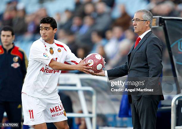 Coach Gregorio Manzano of Mallorca gives the ball to his player Gonzalo Castro during the La Liga match between Getafe and Mallorca at Coliseum...